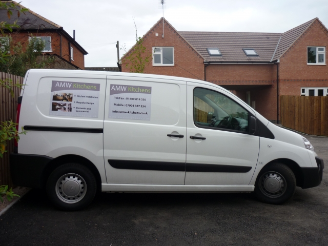 The AMW Kitchens van parked on a driveway